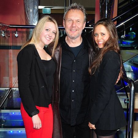 Anthony, Emily, and Daisy posing for a picture